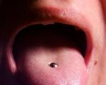 All about tongue piercing: pros and cons of piercing with photos, healing time and consequences of the procedure